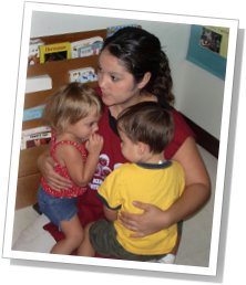 Rosita holding two kids