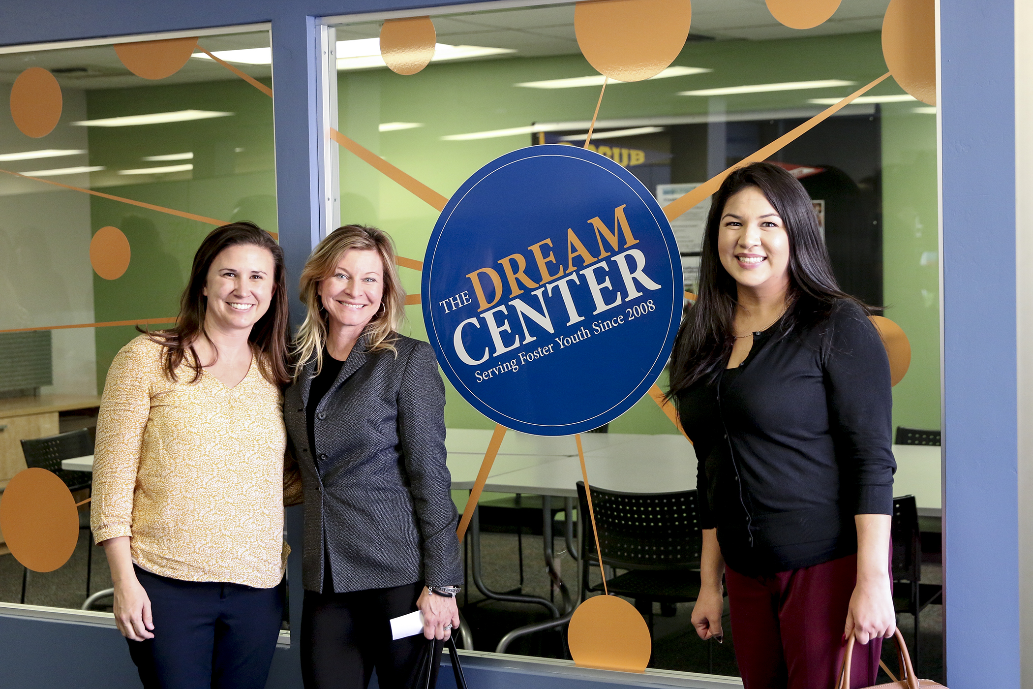 3 Women in front of Dream Center