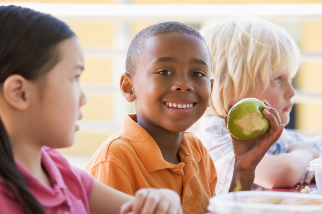 Kindergarten children eating lunch