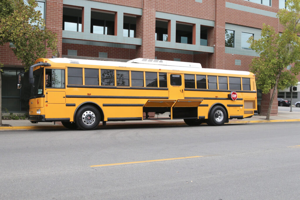 KCSOS charter-style school bus with storage opened